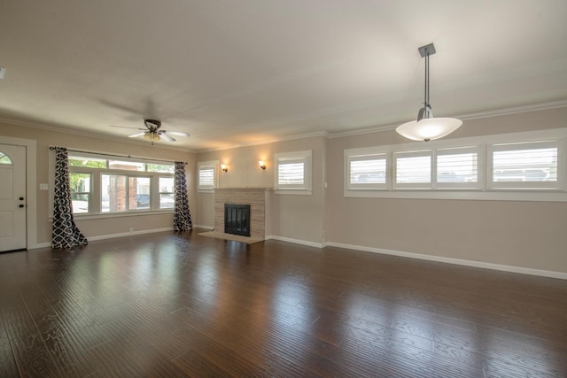 unfurnished living room featuring ceiling fan, crown molding, and baseboards