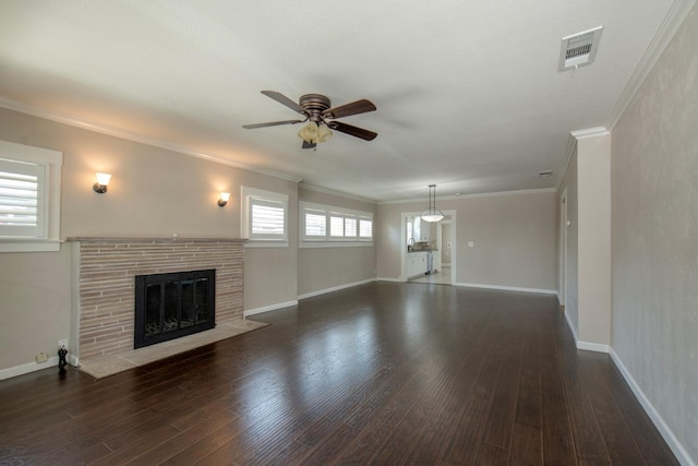 unfurnished living room featuring ornamental molding, ceiling fan, a fireplace with flush hearth, and wood finished floors