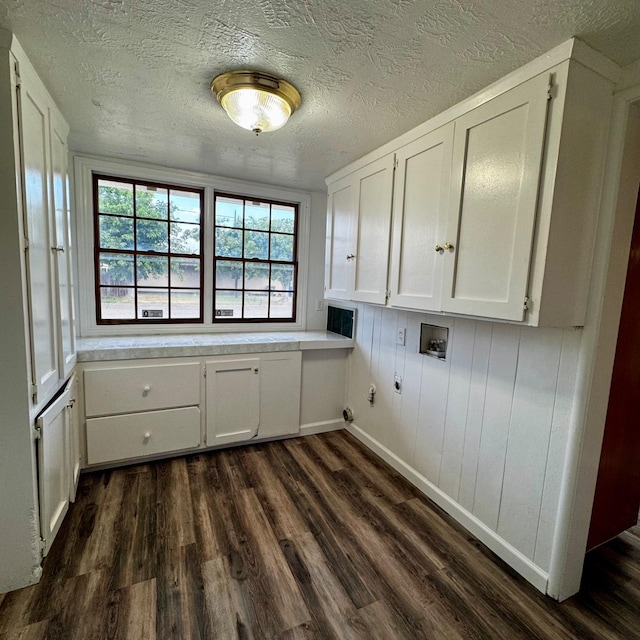 201 Walnut St, Madera, CA 93637 - clothes washing area featuring cabinet space, dark wood-type flooring, hookup for a washing machine, gas dryer hookup, and a textured ceiling