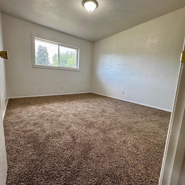 201 Walnut St, Madera, CA 93637 - unfurnished room featuring carpet flooring, baseboards, and a textured ceiling