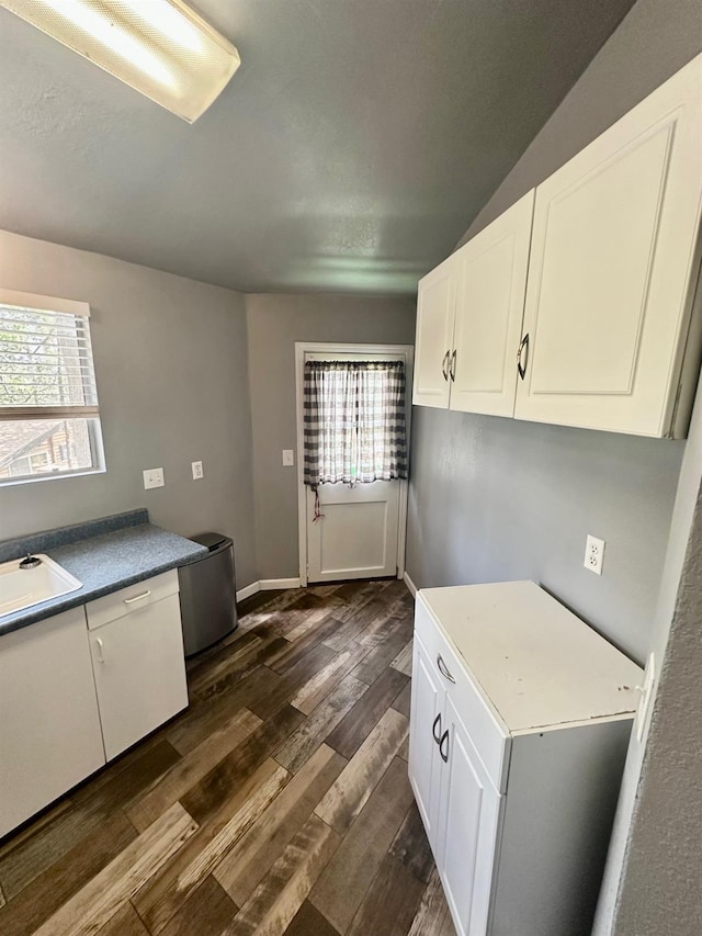 41778 Muskrat Ln, Auberry, CA 93602 - kitchen featuring dark wood-style flooring, white cabinets, a sink, and baseboards