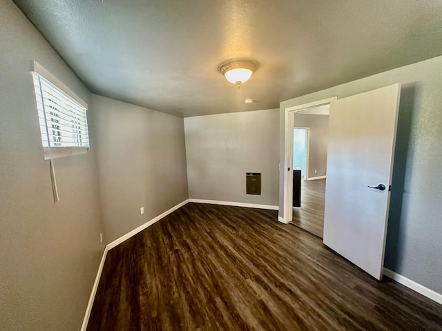 41778 Muskrat Ln, Auberry, CA 93602 - empty room with dark wood-style flooring and baseboards