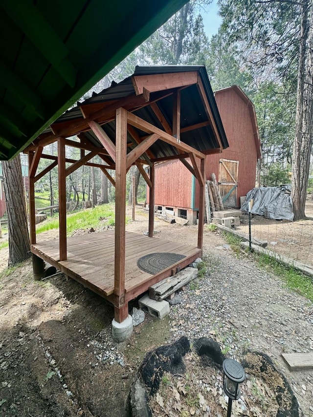 exterior space with a barn and an outbuilding