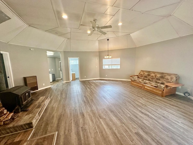 41778 Muskrat Ln, Auberry, CA 93602 - unfurnished living room with a ceiling fan, wood finished floors, baseboards, lofted ceiling, and a chandelier