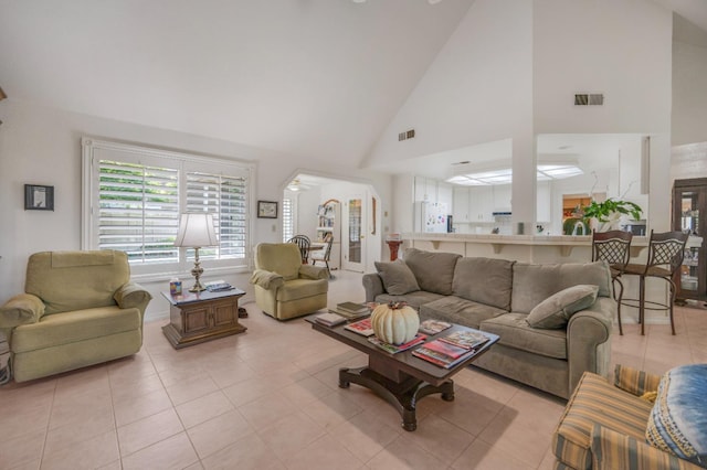 2727 W Bluff Ave Unit 136, Fresno, CA 93711 - living area with light tile patterned flooring, high vaulted ceiling, and visible vents