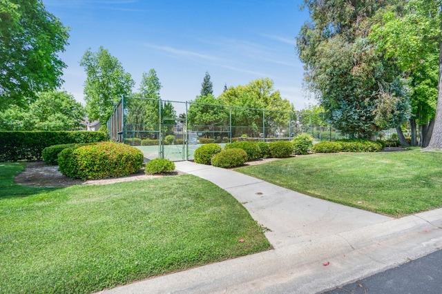 2727 W Bluff Ave Unit 136, Fresno, CA 93711 - view of property's community featuring fence, a yard, and a tennis court