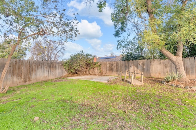 view of yard featuring a patio and a fenced backyard