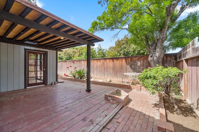 467 E Alluvial Ave Unit 106, Fresno, CA 93720 - wooden deck with a fenced backyard and a fire pit