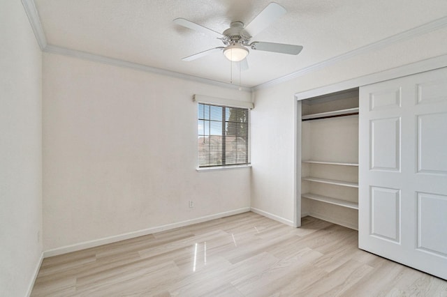 467 E Alluvial Ave Unit 106, Fresno, CA 93720 - unfurnished bedroom with crown molding, light wood finished floors, baseboards, a closet, and ceiling fan