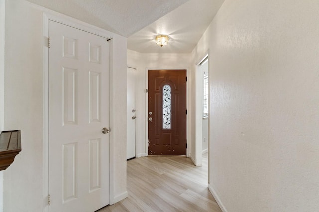 467 E Alluvial Ave Unit 106, Fresno, CA 93720 - entrance foyer featuring baseboards and light wood-style flooring