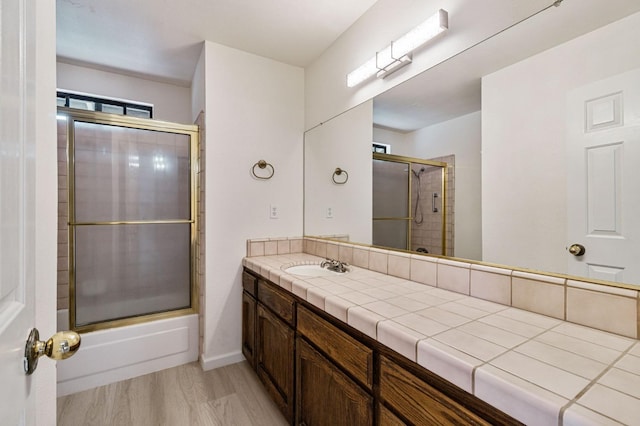467 E Alluvial Ave Unit 106, Fresno, CA 93720 - full bathroom with a shower with door, vanity, and wood finished floors