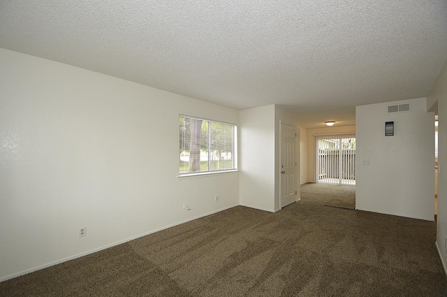 4765 N Cedar Ave Unit 105, Fresno, CA 93726 - carpeted spare room with a textured ceiling and baseboards