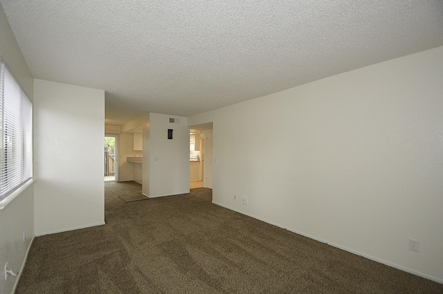 4765 N Cedar Ave Unit 105, Fresno, CA 93726 - carpeted empty room featuring a textured ceiling