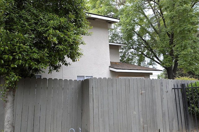 4765 N Cedar Ave Unit 105, Fresno, CA 93726 - view of property exterior featuring stucco siding and fence