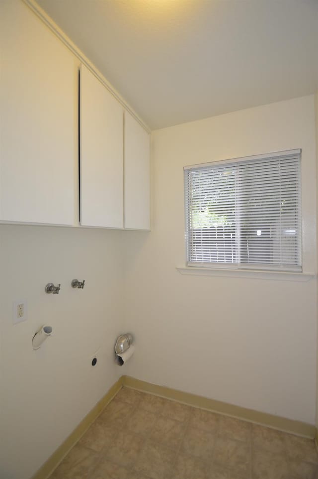4765 N Cedar Ave Unit 105, Fresno, CA 93726 - laundry area featuring cabinet space, electric dryer hookup, baseboards, and washer hookup