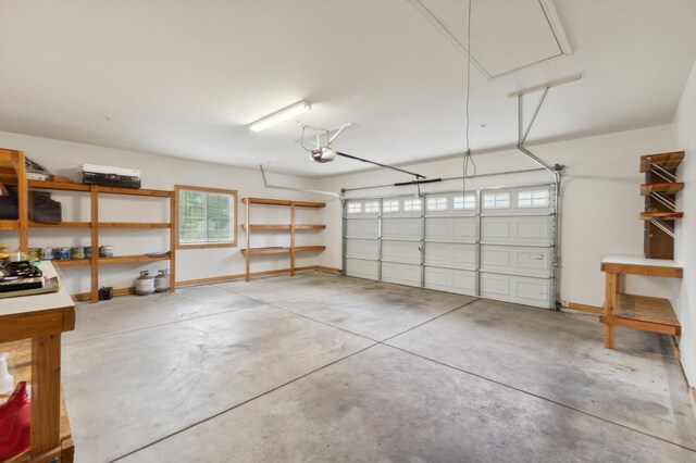 garage featuring baseboards and a garage door opener