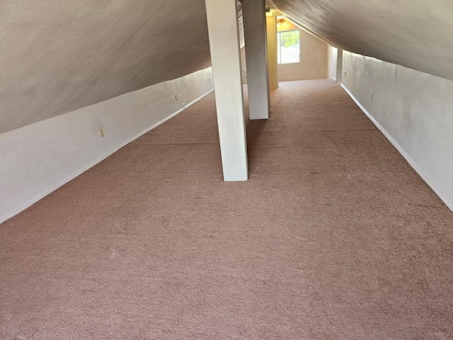 bonus room with baseboards, carpet floors, and vaulted ceiling