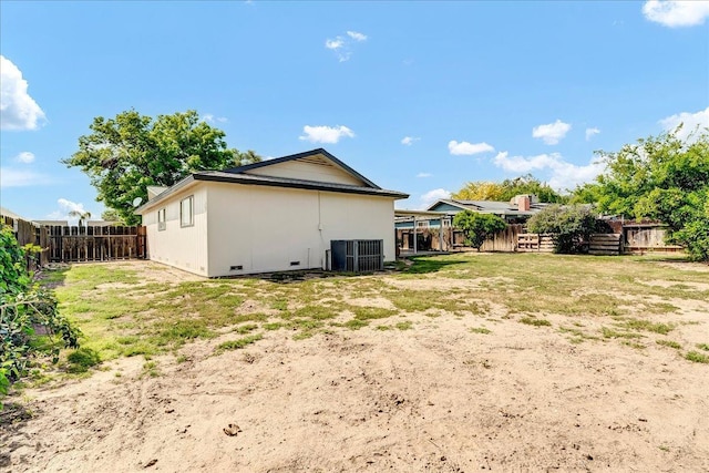 30 S Cambridge Dr, Lemoore, CA 93245 - back of house featuring central air condition unit and a fenced backyard