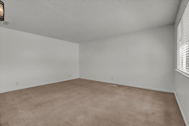 30 S Cambridge Dr, Lemoore, CA 93245 - unfurnished room featuring carpet flooring, a textured ceiling, and baseboards