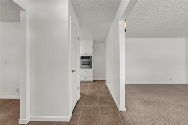 30 S Cambridge Dr, Lemoore, CA 93245 - hall with a textured ceiling, tile patterned flooring, and baseboards