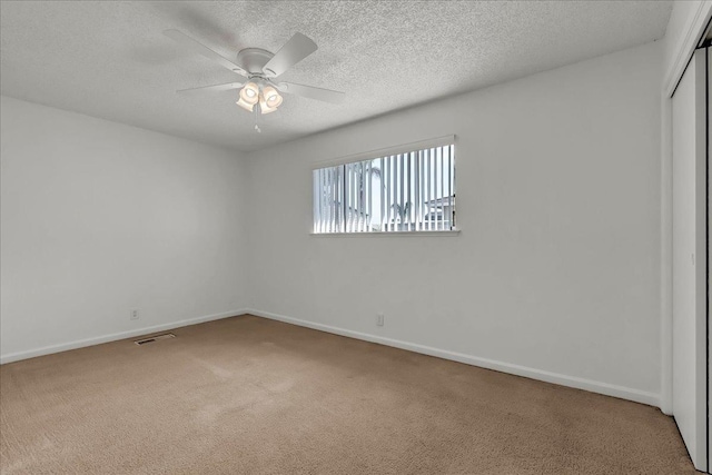 30 S Cambridge Dr, Lemoore, CA 93245 - spare room featuring carpet, a textured ceiling, ceiling fan, and baseboards