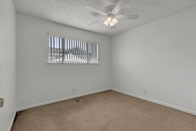 30 S Cambridge Dr, Lemoore, CA 93245 - carpeted spare room featuring ceiling fan, baseboards, and a textured ceiling