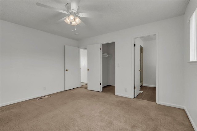 30 S Cambridge Dr, Lemoore, CA 93245 - unfurnished bedroom featuring carpet, baseboards, a closet, and ceiling fan
