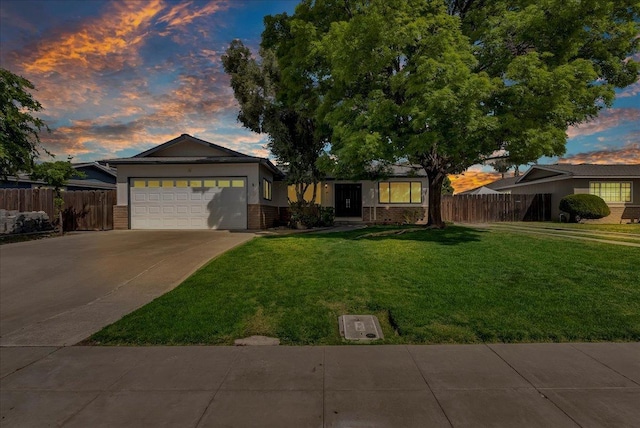 30 S Cambridge Dr, Lemoore, CA 93245 - single story home featuring a garage, driveway, and brick siding