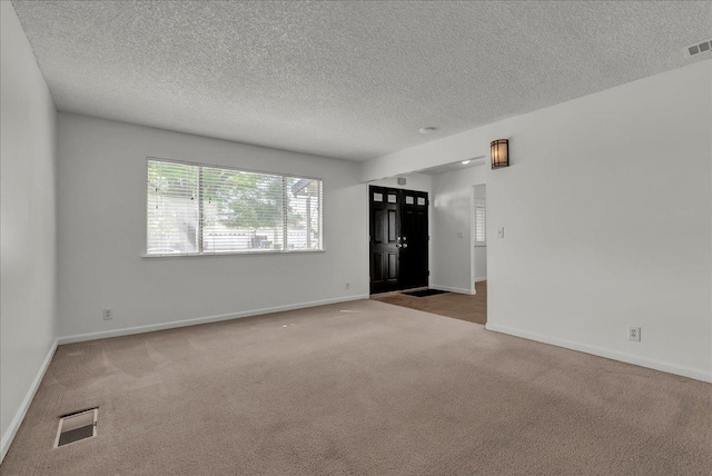 30 S Cambridge Dr, Lemoore, CA 93245 - carpeted spare room featuring a textured ceiling and baseboards