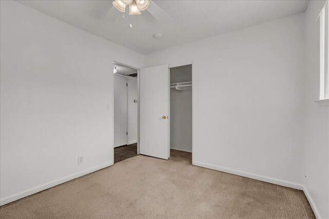 30 S Cambridge Dr, Lemoore, CA 93245 - unfurnished bedroom featuring carpet flooring, baseboards, a closet, and a ceiling fan