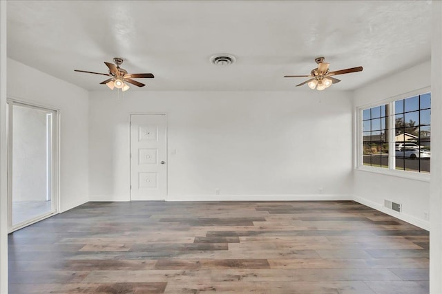230 E Sycamore Dr, Hanford, CA 93230 - spare room with baseboards, visible vents, wood finished floors, and a ceiling fan