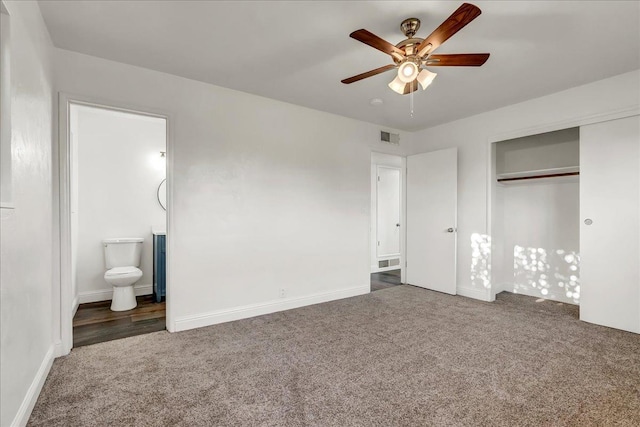 230 E Sycamore Dr, Hanford, CA 93230 - unfurnished bedroom featuring visible vents, ensuite bathroom, a closet, baseboards, and carpet floors