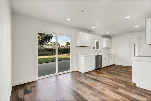 230 E Sycamore Dr, Hanford, CA 93230 - kitchen with white cabinets, a sink, light countertops, dark wood-style floors, and dishwasher