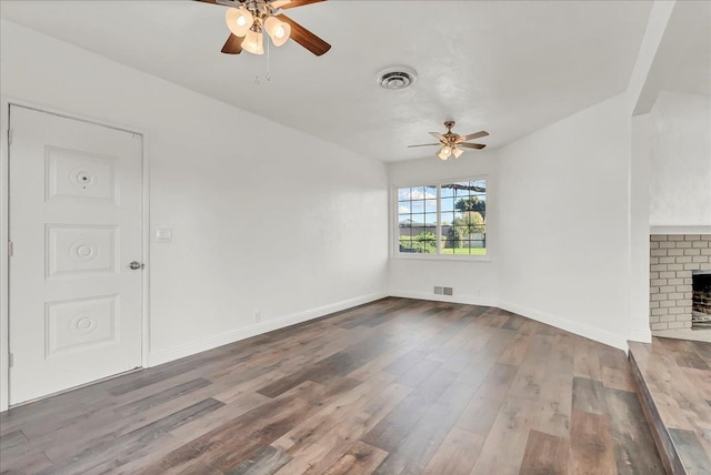 230 E Sycamore Dr, Hanford, CA 93230 - unfurnished living room with wood finished floors, visible vents, and a ceiling fan