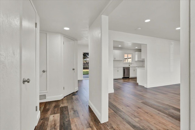 230 E Sycamore Dr, Hanford, CA 93230 - interior space featuring dark wood-type flooring, visible vents, recessed lighting, and a sink