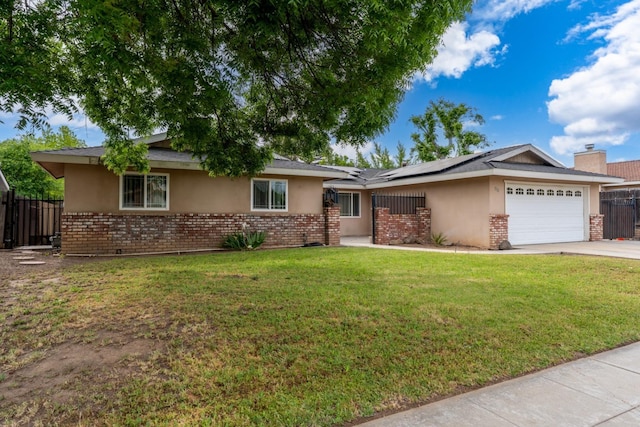 single story home featuring concrete driveway, solar panels, stucco siding, brick siding, and a garage