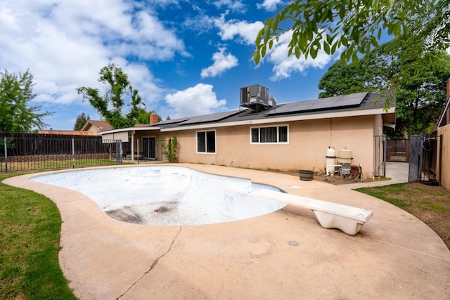 back of house featuring a gate, a patio, a fenced backyard, and stucco siding