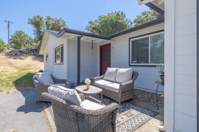 view of patio with an outdoor hangout area and a ceiling fan