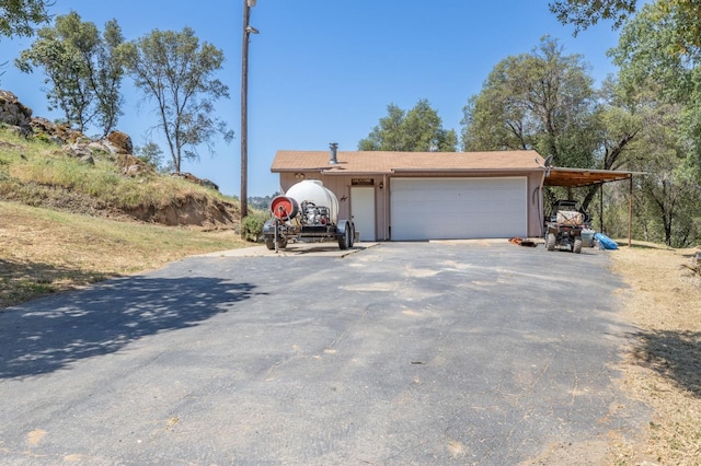 view of front of home with driveway and an attached garage