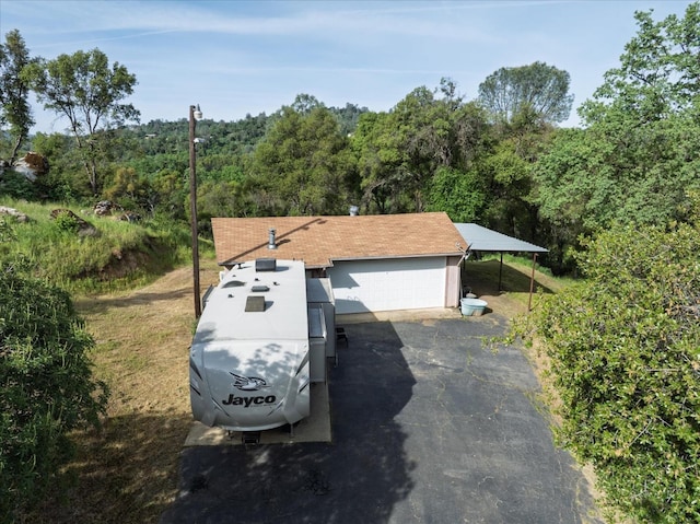 exterior space with a wooded view