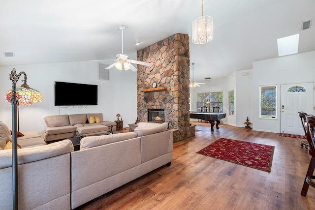 living room with wood finished floors, ceiling fan, high vaulted ceiling, and visible vents