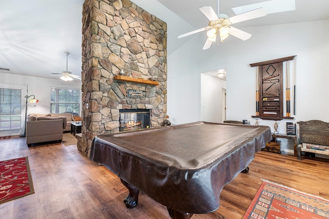 rec room featuring a fireplace, ceiling fan, high vaulted ceiling, pool table, and wood finished floors