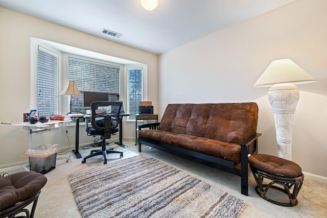 carpeted home office with visible vents and baseboards