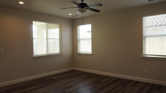 unfurnished room featuring recessed lighting, dark wood finished floors, ceiling fan, and baseboards