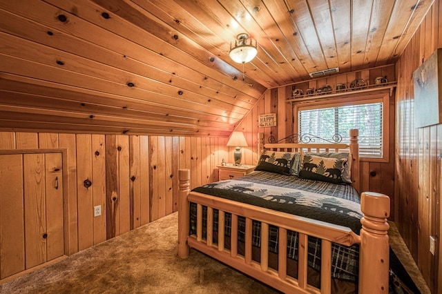 bedroom with wood ceiling, visible vents, wooden walls, vaulted ceiling, and carpet