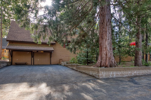 garage with aphalt driveway