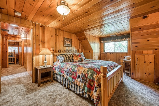 carpeted bedroom featuring wooden ceiling, wooden walls, and multiple windows