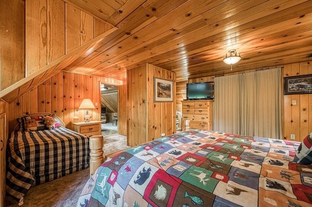 bedroom featuring wooden walls and carpet flooring
