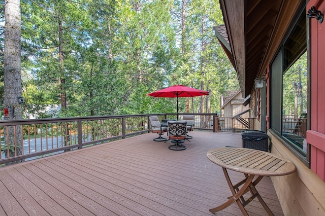 deck featuring outdoor dining area