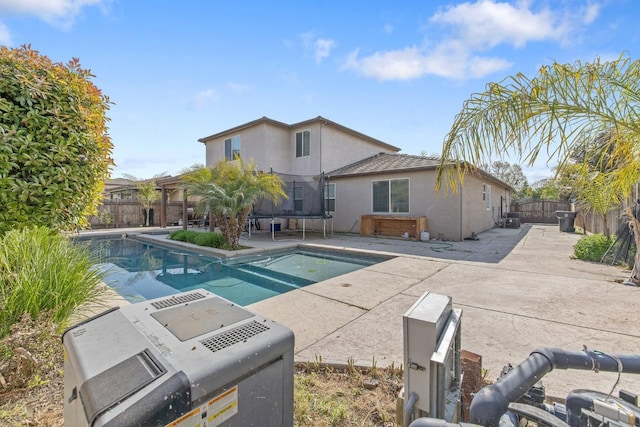 view of swimming pool featuring a fenced in pool, a fenced backyard, and a patio area